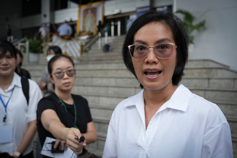 Lawyer Nadthasiri Bergman speaks to reporters outside the court in Bangkok, Oct. 3, 2025.