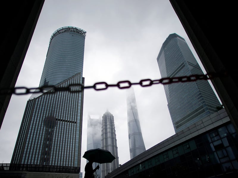 A man walks in Lujiazui financial district in Pudong in Shanghai, China Sept. 17, 2020.