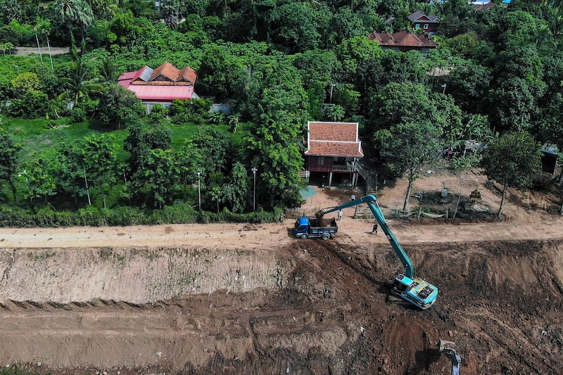 Workers dig the Funan Techo canal at Prek Takeo in Kandal province, July 9, 2024. (Tang Chhin Sothy/AFP)