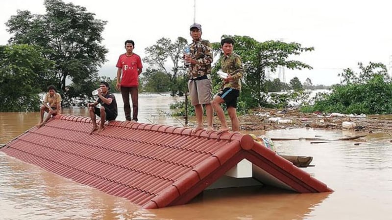 Lao villagers in Attapeu province's Sanamxay district wait for rescue following collapse of a dam, July 24, 2018.