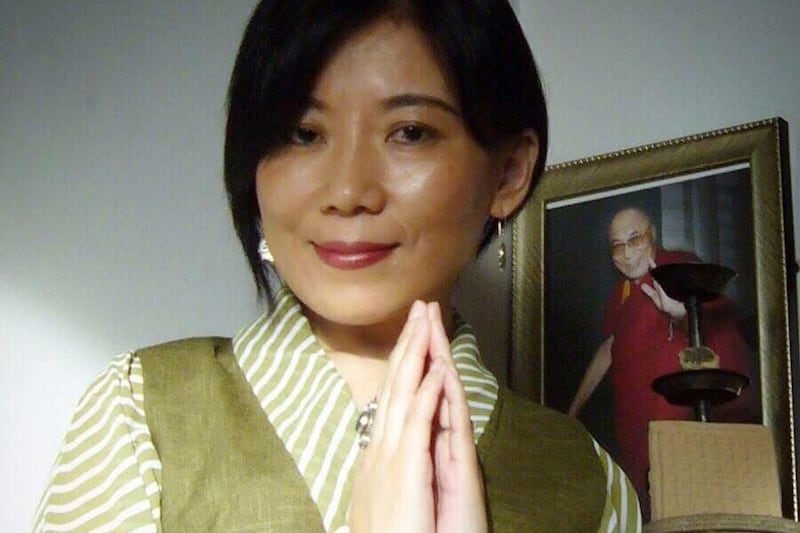 Beijing-based Tibetan writer and poet Tsering Woeser poses for a photo in Beijing in 2010.