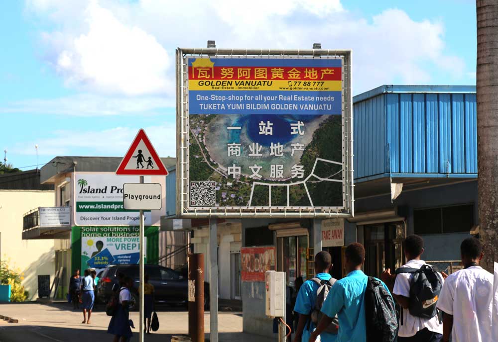 A real estate sign in Port Vila. These signs are commonplace in the capital and tailor-made for Chinese investors. Photo: RFA